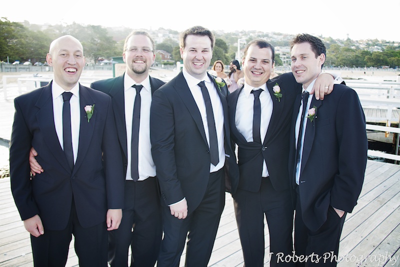 Groomsmen laughing at Balmoral Beach - wedding photography sydney